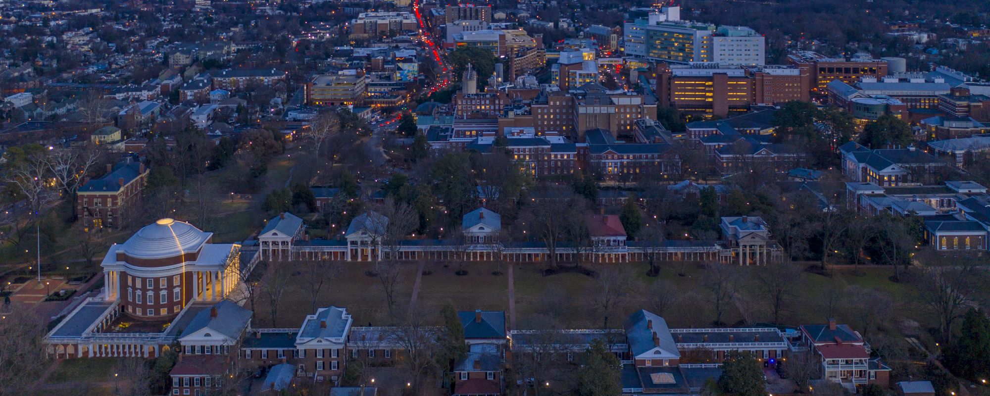 Aerial photo of the UVA Lawn and Charlottesville at dusk