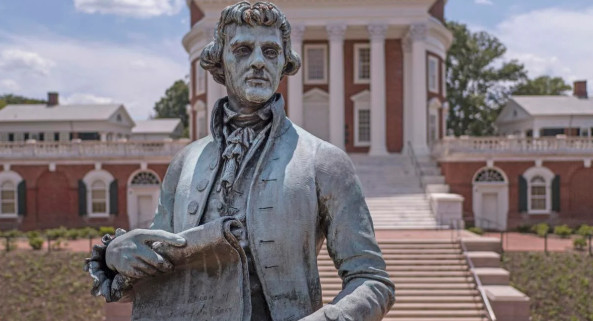 Photo of a statue of Thomas Jefferson that stands in front of the Rotunda building on UVA's campus